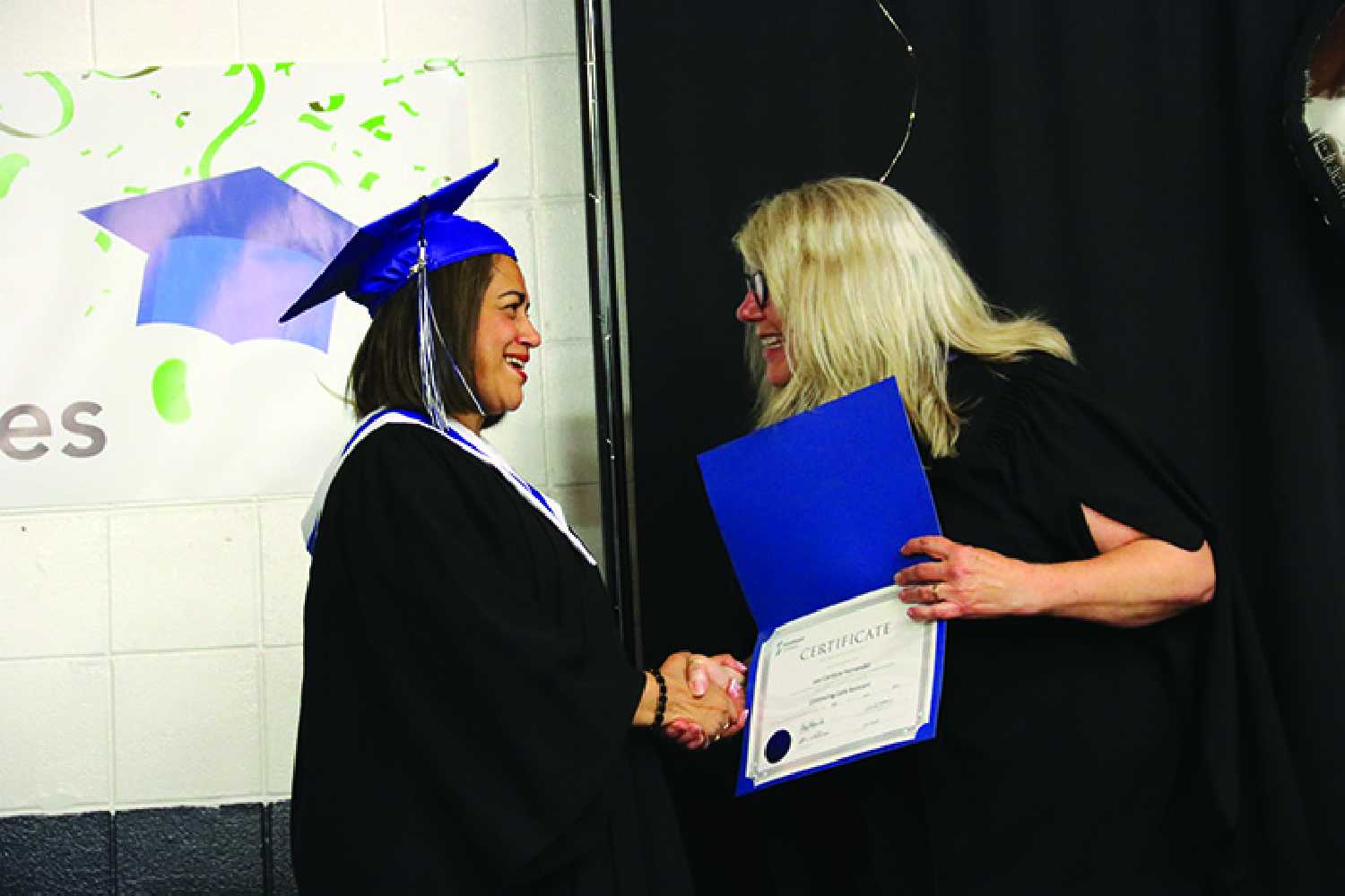 Lesi Cardoza Hernandez receiving her CCA certificate from CEO and President of Southeast College, Jody Holzmiller